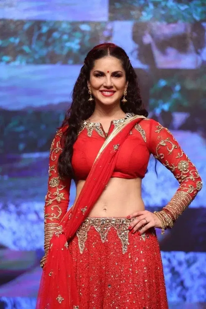 SUNNY LEONE IMAGES IN RED SAREE AT TELUGU MOVIE AUDIO LAUNCH 5